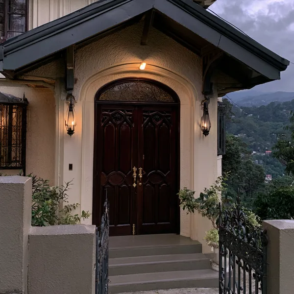 The gothic front door of the puzzle house